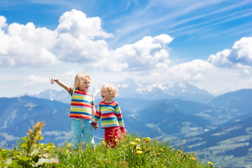 Fototapeta premium Children hiking in Alps mountains. Kids outdoor.