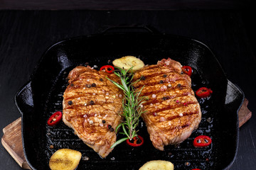 Grilled pork steak in grill pan