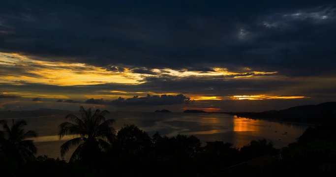 Sunset timelapse with palm trees silhouette at sand beach of koh Phangan island,Thailand