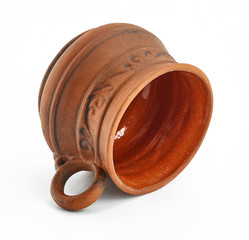 clay ethnic dishes on white background