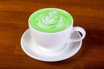Green cappuccino with cream