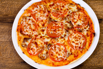 Pizza with beef and tomato