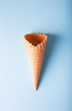 Empty cone wafers on a blue background.