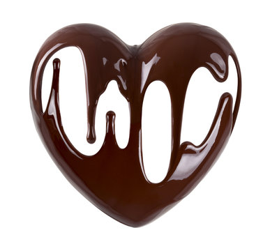 Chocolate in the form of heart. Melted chocolate syrup on white background. Liquid chocolate on a white background.