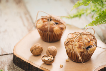 Dellicious homemade nut muffins on table. Sweet pastries
