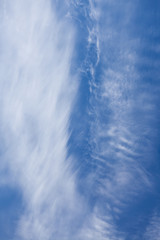Wisp shape cirrus clouds on blue sky