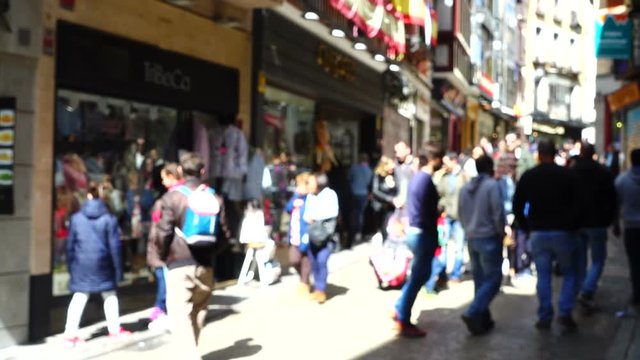 Shopping street in an old part of the city of Toledo. Slow motion.	Out of focus.