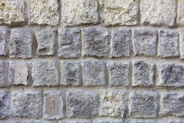 Stone wall from a large cobblestone sandstone close-up