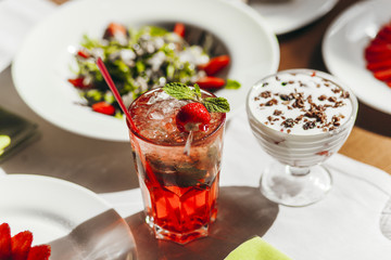 Freshly made strawberry mojitos. Rustic style.