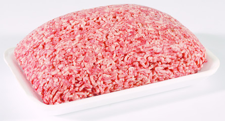 fresh raw mince beef meat on white tray isolated over white background