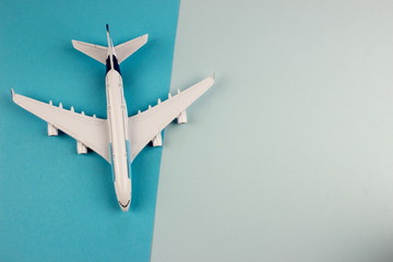 Plane, aircraft on color background. Travel concept. Empty space for text and design