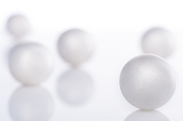 scattered pearl pearls on a white background