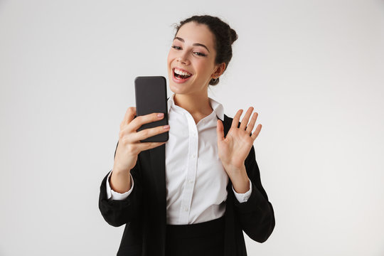 Young Happy Business Woman Talking By Phone Waving To Friends.