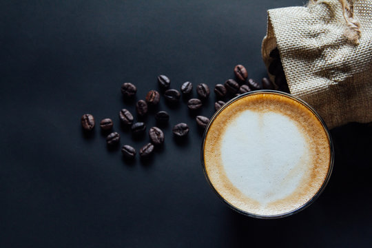 Latte Art ,Croissant And Moka Pot With Roasted Coffee On Black Background In The Morning Top View And Instagram Style Filter Photo Vintage Tone