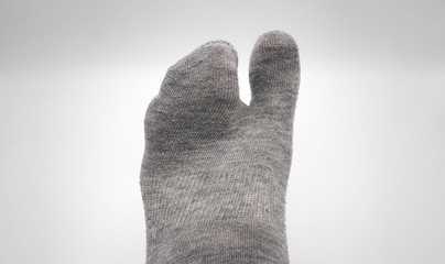 Sock with feet in grey color ISOLATED