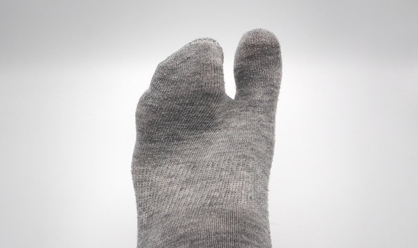 Sock with feet in grey color ISOLATED