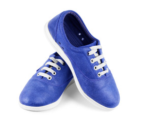 pair of new blue sneakers isolated on white background