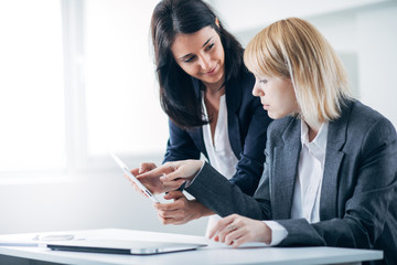 Colleagues working in office