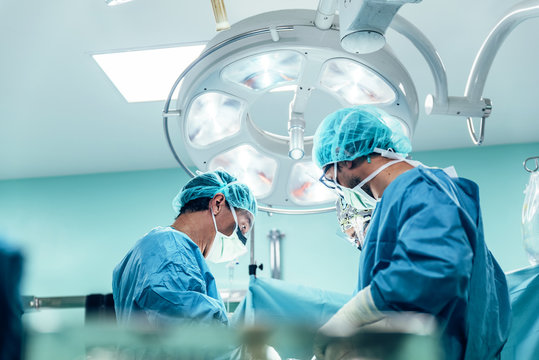Team of Surgeons Operating in the Hospital.