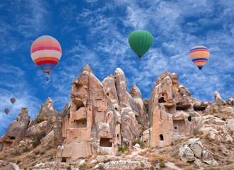 Fototapeta na wymiar Colorful hot air balloons flying over Red valley in Cappadocia, Anatolia, Turkey