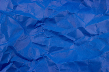 Obraz premium Crumpled dark blue torn paper background. Empty space for text and design. Template for banner and message