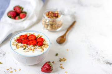 Fototapeta na wymiar Granola with yogurt and strawberry, healthy breakfast