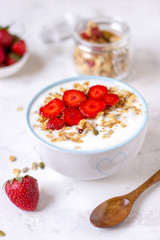 Granola with yogurt and strawberry, healthy breakfast