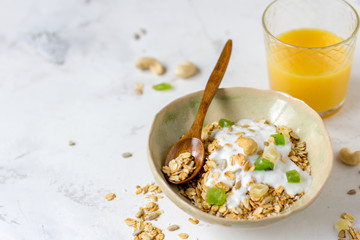Granola with candied fruits and yogurt, healthy food