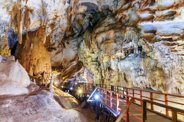 Wooden walkway among stalactites inside Paradise Cave, Vietnam