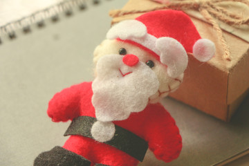 Santa doll with gift box.