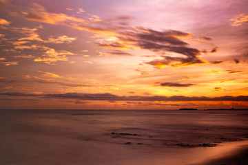 Fototapeta na wymiar Sunset at calm beach in Bengal bay
