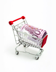 Metal basket with an Euro 500 banknote in it. Consumption, shopping concept, pushcart.
