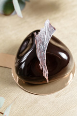 Delicious chocolates cakes. Glossy glaze and chocolate decor. Different forms. dessert pie for sale at the shop.