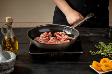 Chef cook the quail into the frying pan