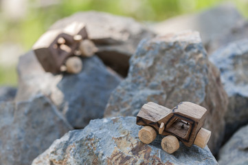 SUV toy car in nature / Wooden SUV, toy car in an extreme landscape.