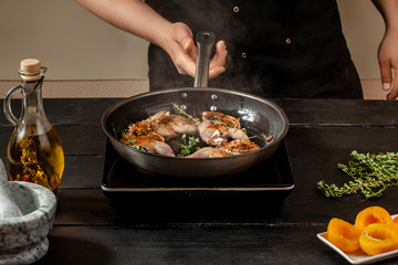 Chef cook the quail into the frying pan