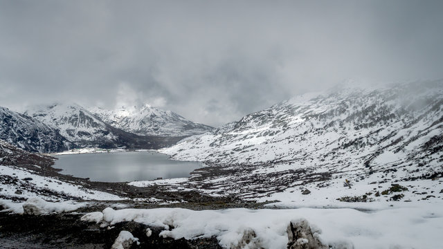 Sarathang lake surrounded by snow covered mountains on all side near Changu lake in May, Sikkim, India