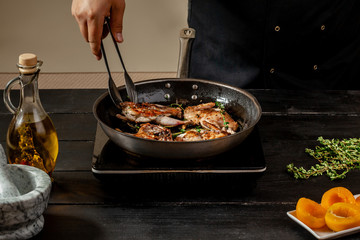 Chef cook the quail into the frying pan
