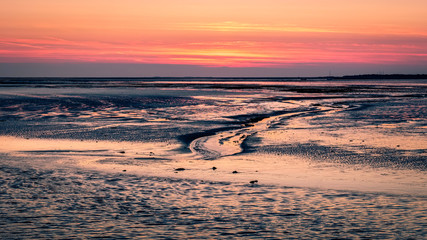 The sky turns purple after sundown when the ferry from Lauwersoog arrives at the harbour of the Wadden Island of Schiermonnikoog (Friesland, the Netherlands) on a late September evening.