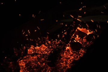 Fototapeta na wymiar Bonfire. Firewood burn in the grill, BBQ