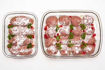 Meat minced red with aromatic seasonings on a white background.