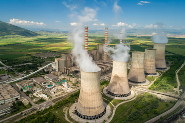 Aerial view the plant producing electrical energy with large pipes at Kozani in northern Greece. - obrazy, fototapety, plakaty