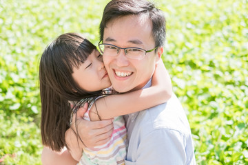 father and daughter smile happily