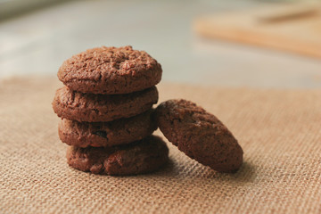 Chocolate chip cookies on brown background.