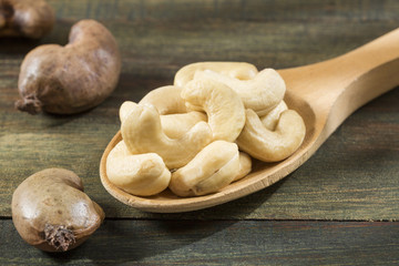 Cashew nut - Anacardium occidentale. Wooden spoon