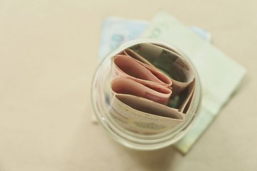 Money in glass jar ,Thai money.