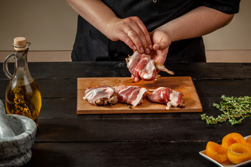 Preparing quail specialty, rolling quail with bacon