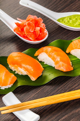 sushi with salmon on a leaf