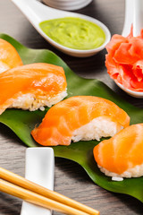 sushi with salmon on a leaf
