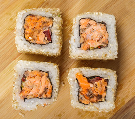 Japanese food, rolls with salmon in sesame